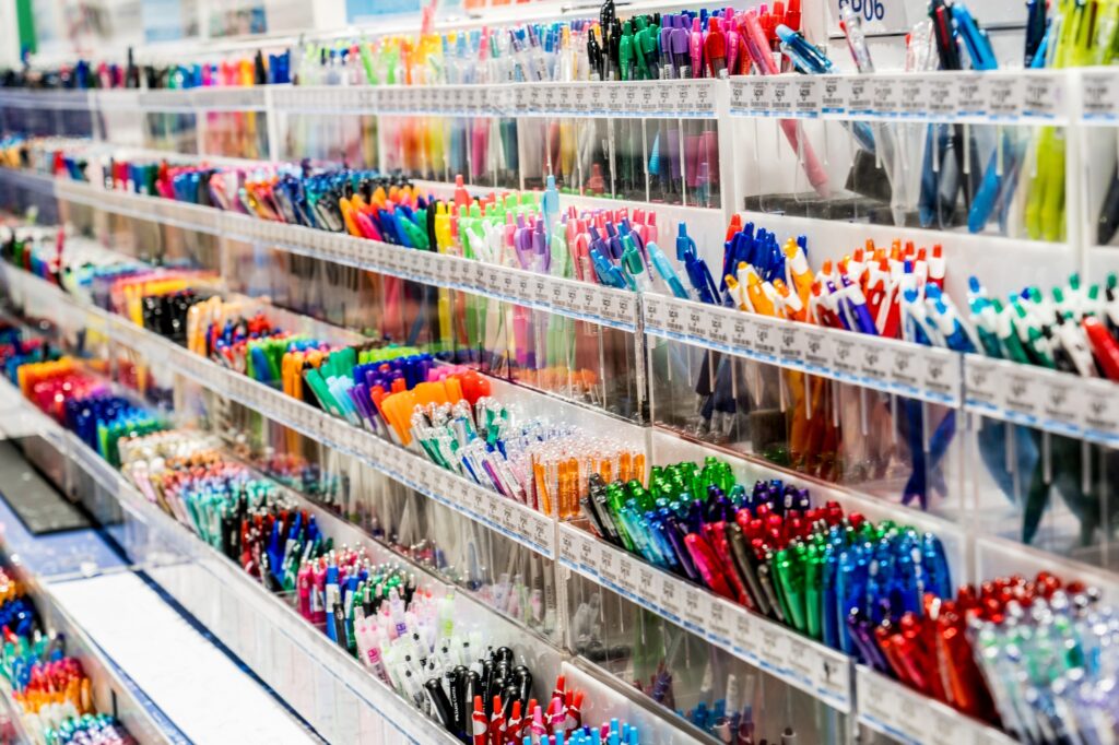 Various color pens on display at stationery shop. Back to school office supplies shopping